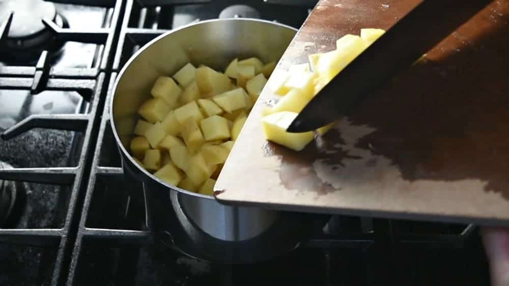 Adding Diced Potato to Saucepan