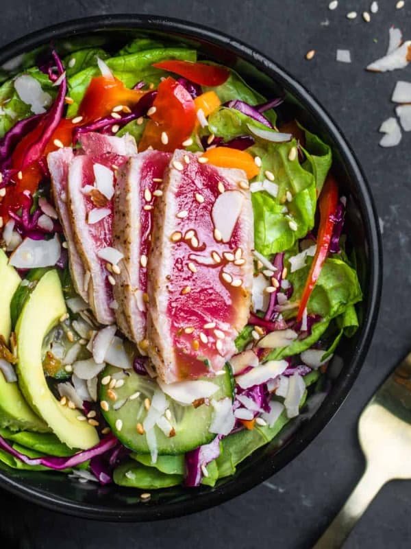 Ahi Tuna Salad served in a black bowl and photographed from the top.