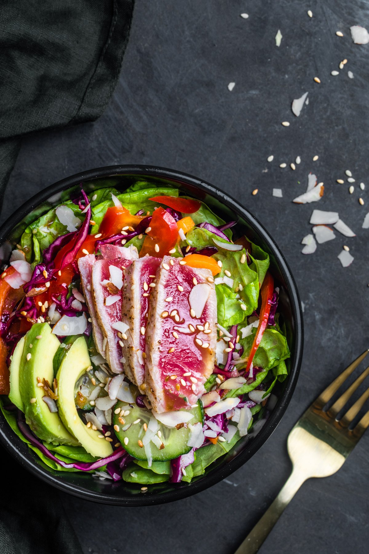 Ahi Tuna Salad served in a black bowl and photographed from the top.