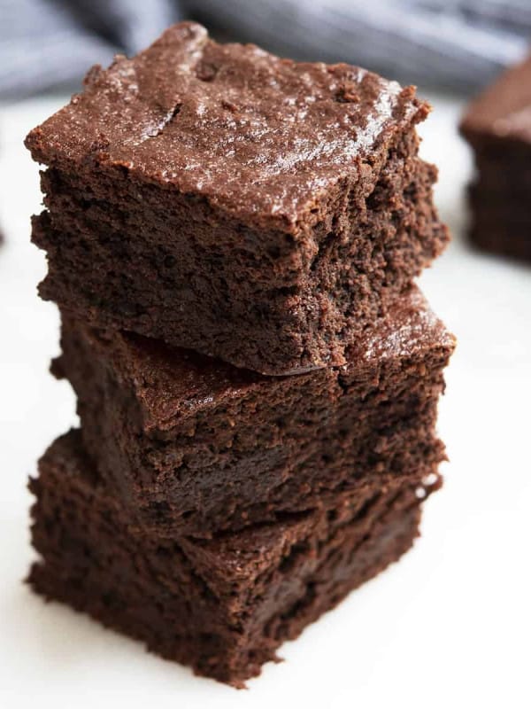 Almond Flour Brownies stacked on a white board