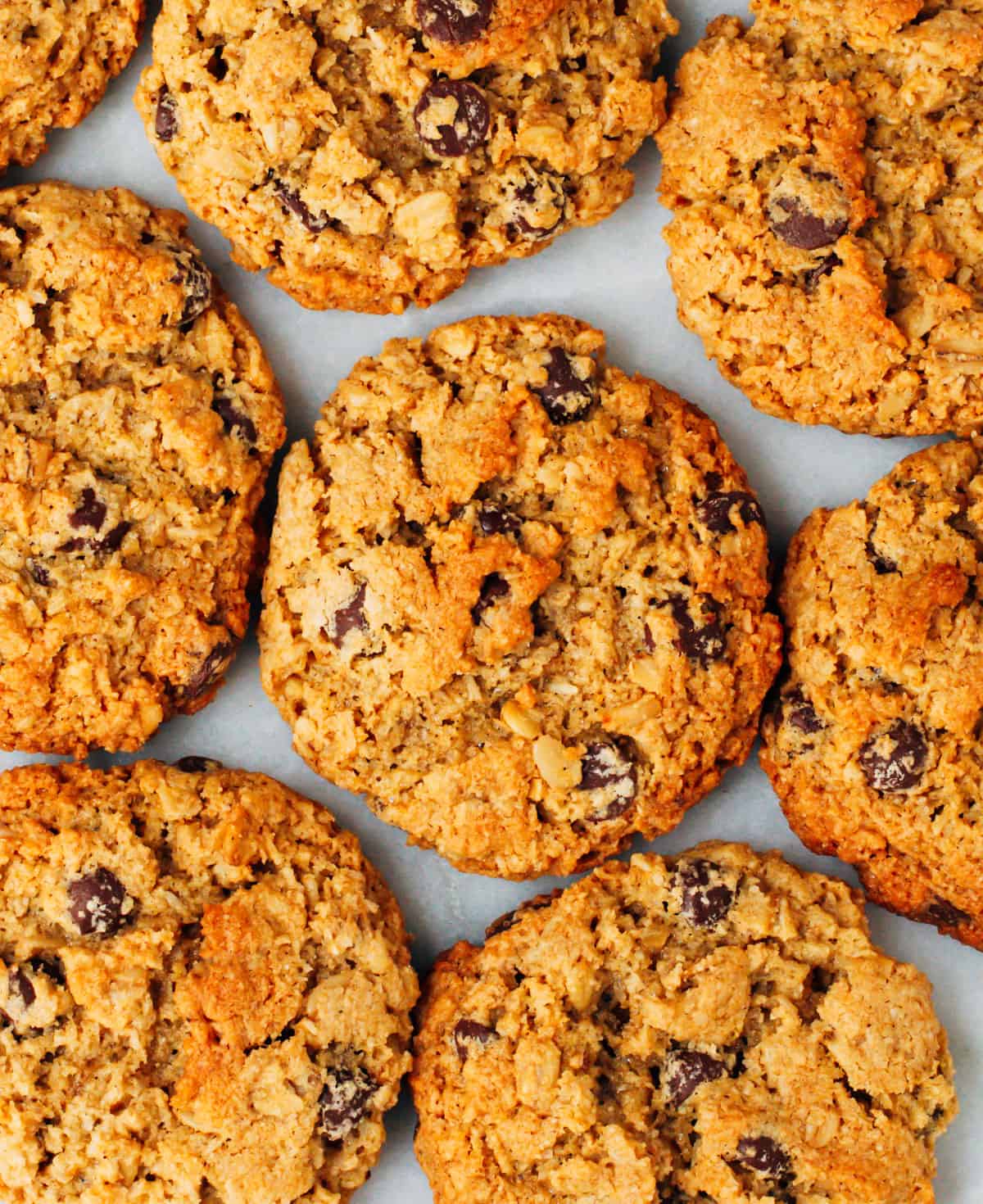 Almond Flour Oatmeal Cookies stacked on a white marble board photographed from above