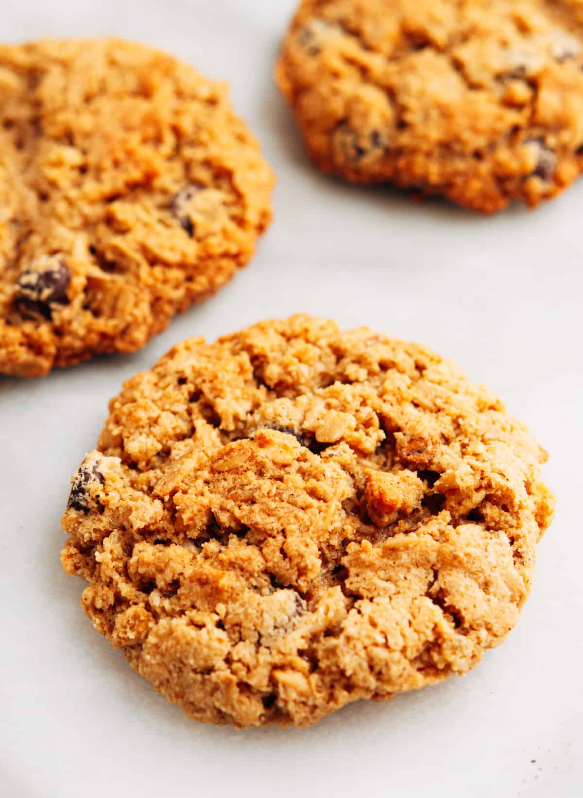 Almond Flour Oatmeal Cookies stacked on a white marble board