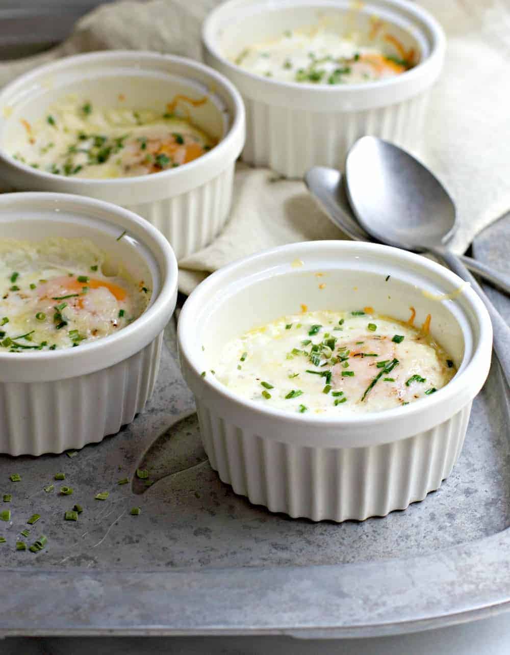 Baked Eggs served in white ramekins