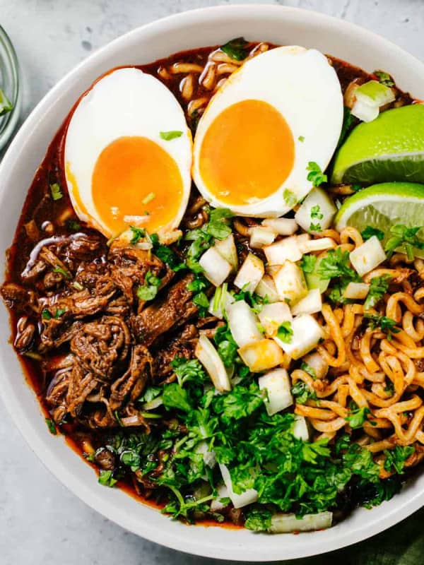 Birria Ramen in a white bowl photographed from above.