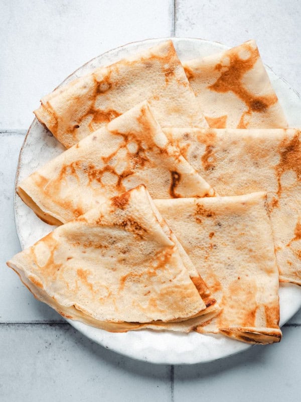 Breakfast Crepes served on a white ceramic plate.