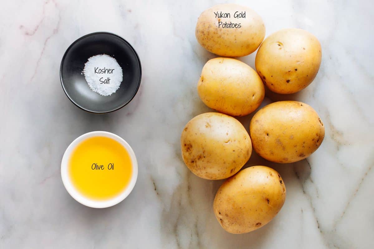 Breakfast Potatoes Ingredients on a white marble board.