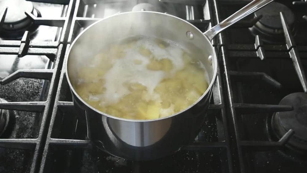 Bring water and potatoes to boil