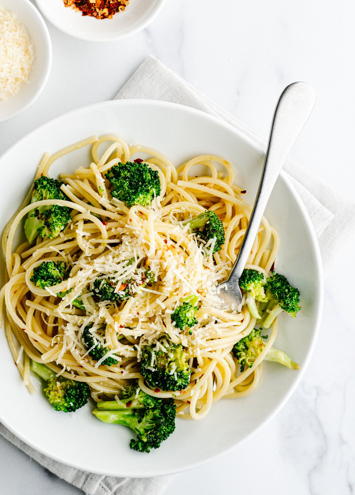 Broccoli Pasta served in a white bowl photographed from above.