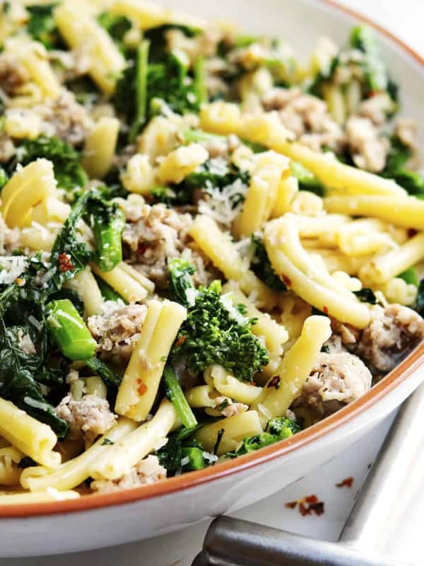 Broccoli Rabe and Sausage Pasta served in a white bowl