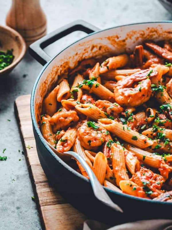 Cajun Shrimp Pasta served in a skillet and photographed at an angle.