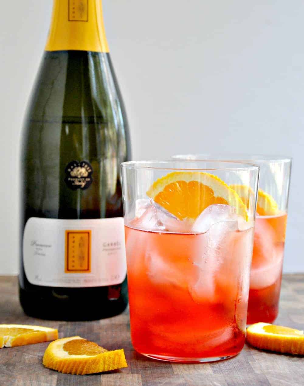 Campari Spritz served in clear glasses with orange slices