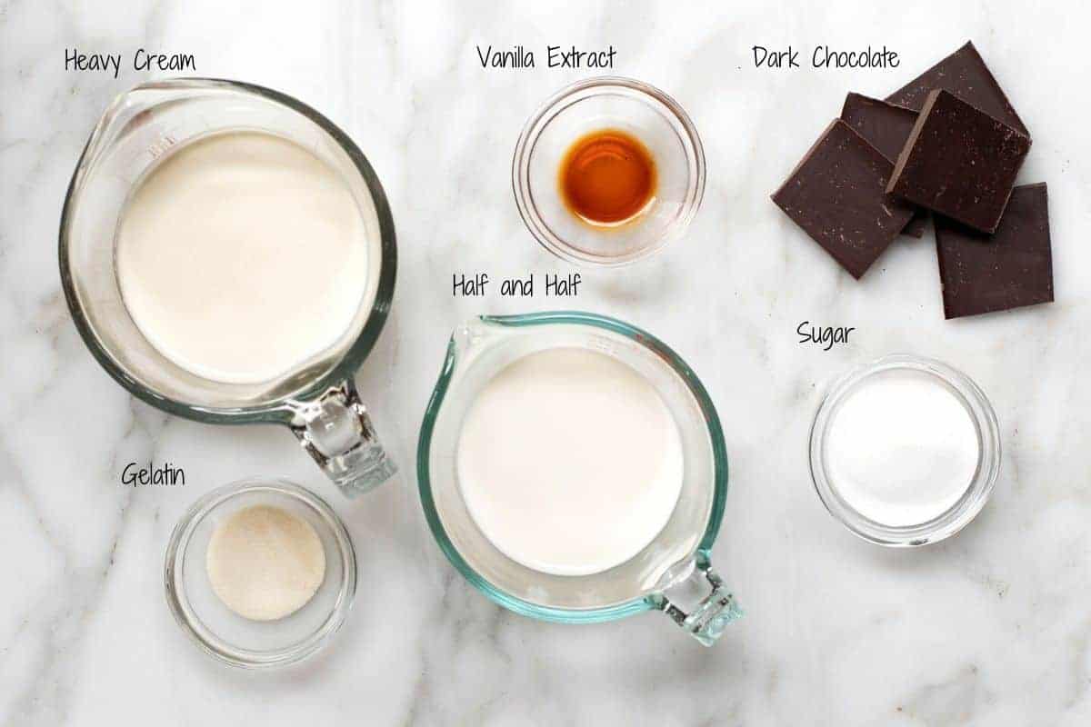 Chocolate Panna Cotta Ingredients on a white marble board