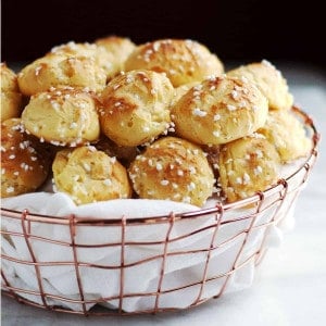 chouquettes served in a cloth lined copper basket