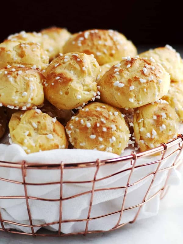 chouquettes served in a cloth lined copper basket