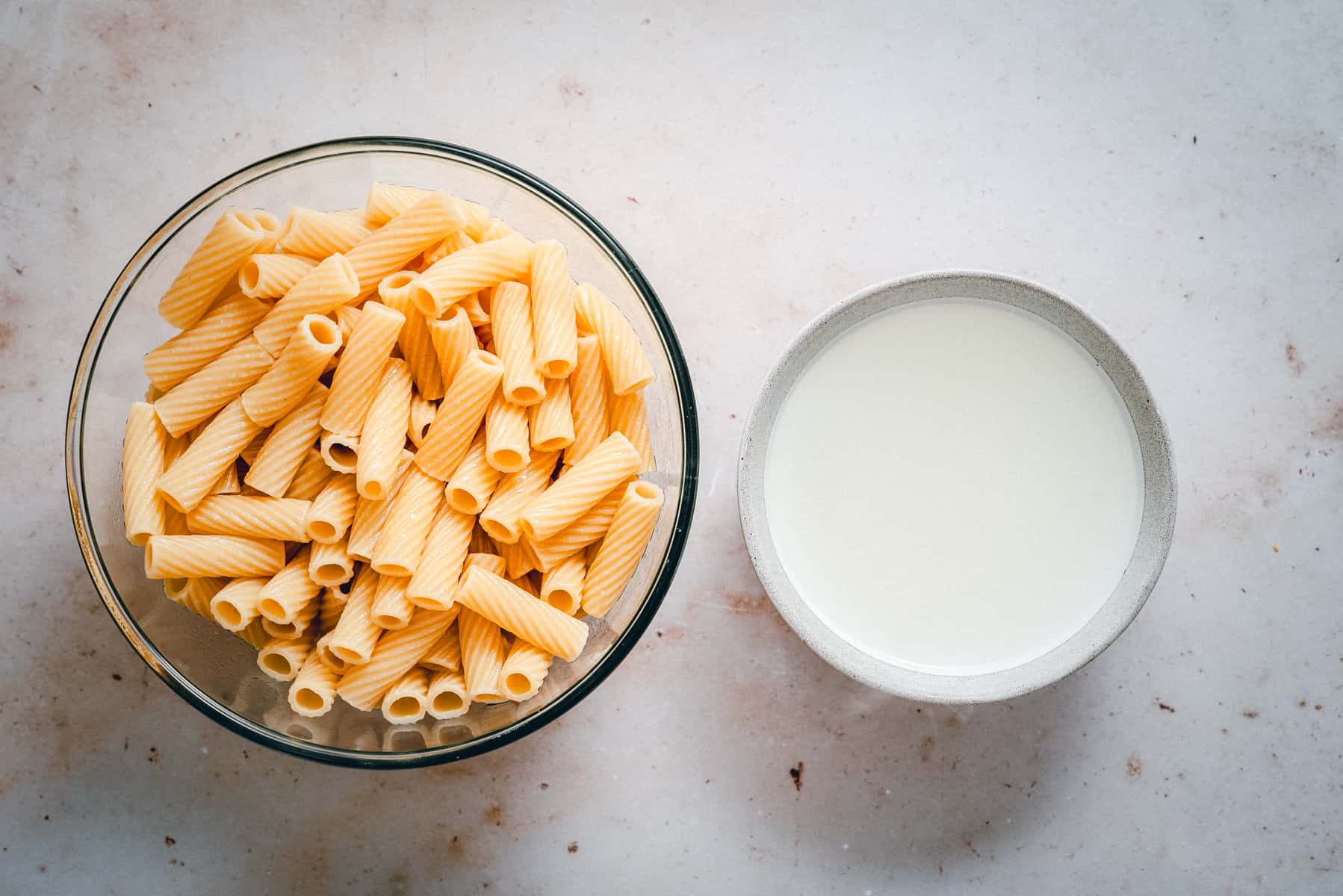 Cooked pasta and reserved cooking water.