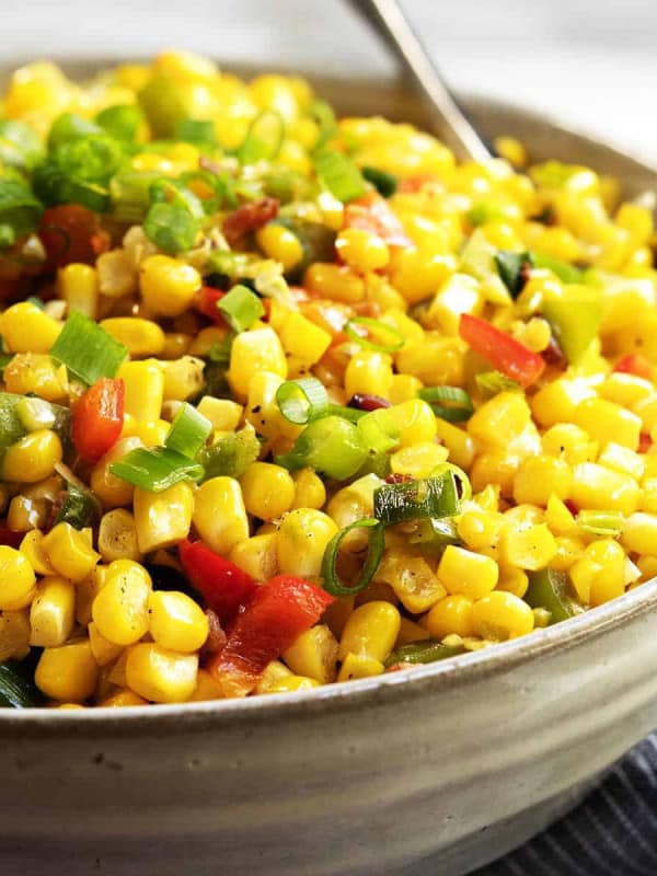 Corn Maque Choux served in a gray ceramic bowl