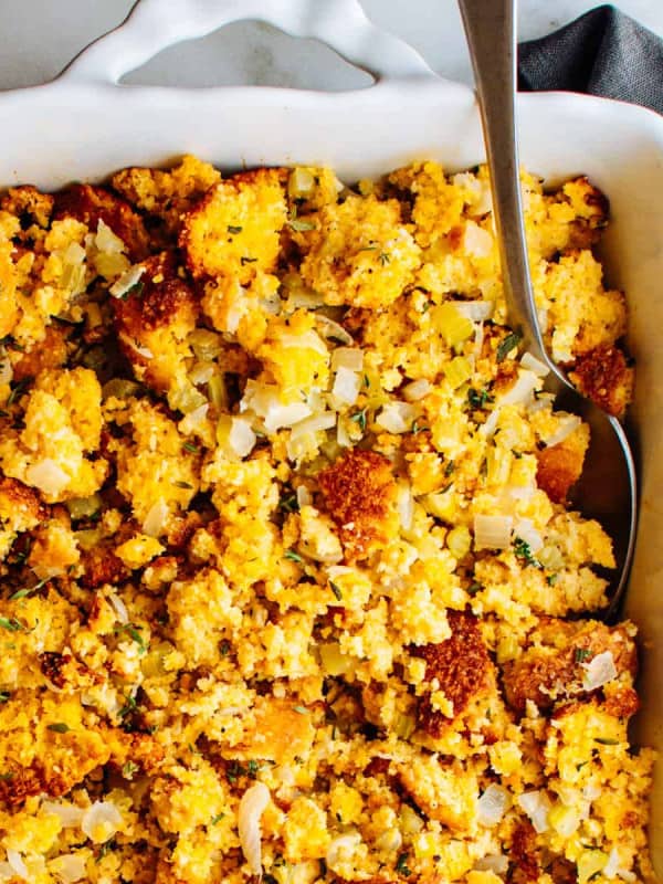 Cornbread Dressing served in a white baking dish.