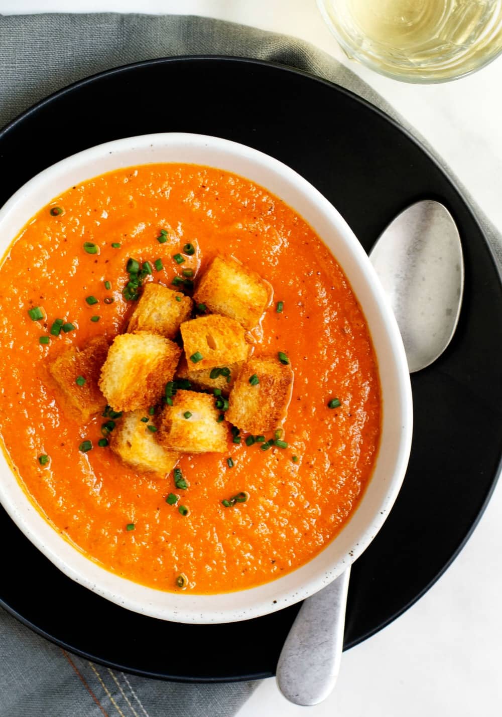 Creamy Tomato Bisque served in a white oval bowl