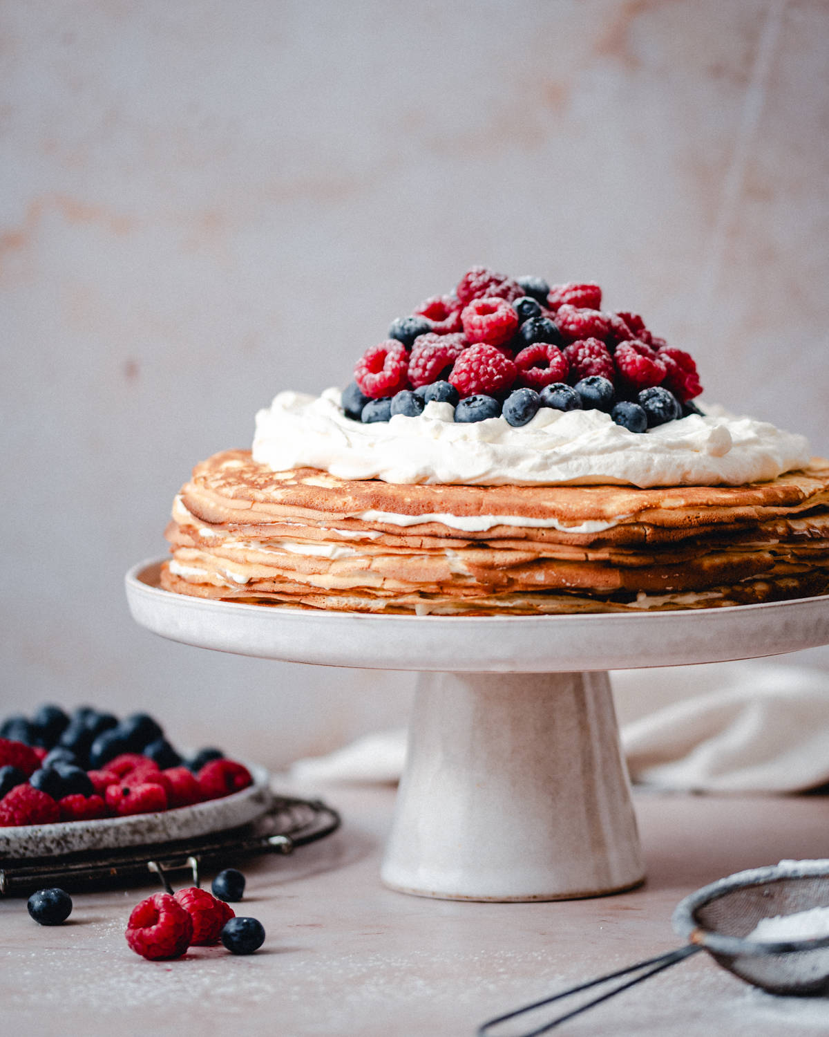 Crepe Cake on pedestal ready to cut.