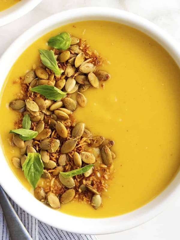 Delicata Squash Soup served in a white bowl