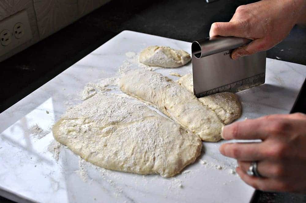 Dividing English Muffin Dough with a bench scraper