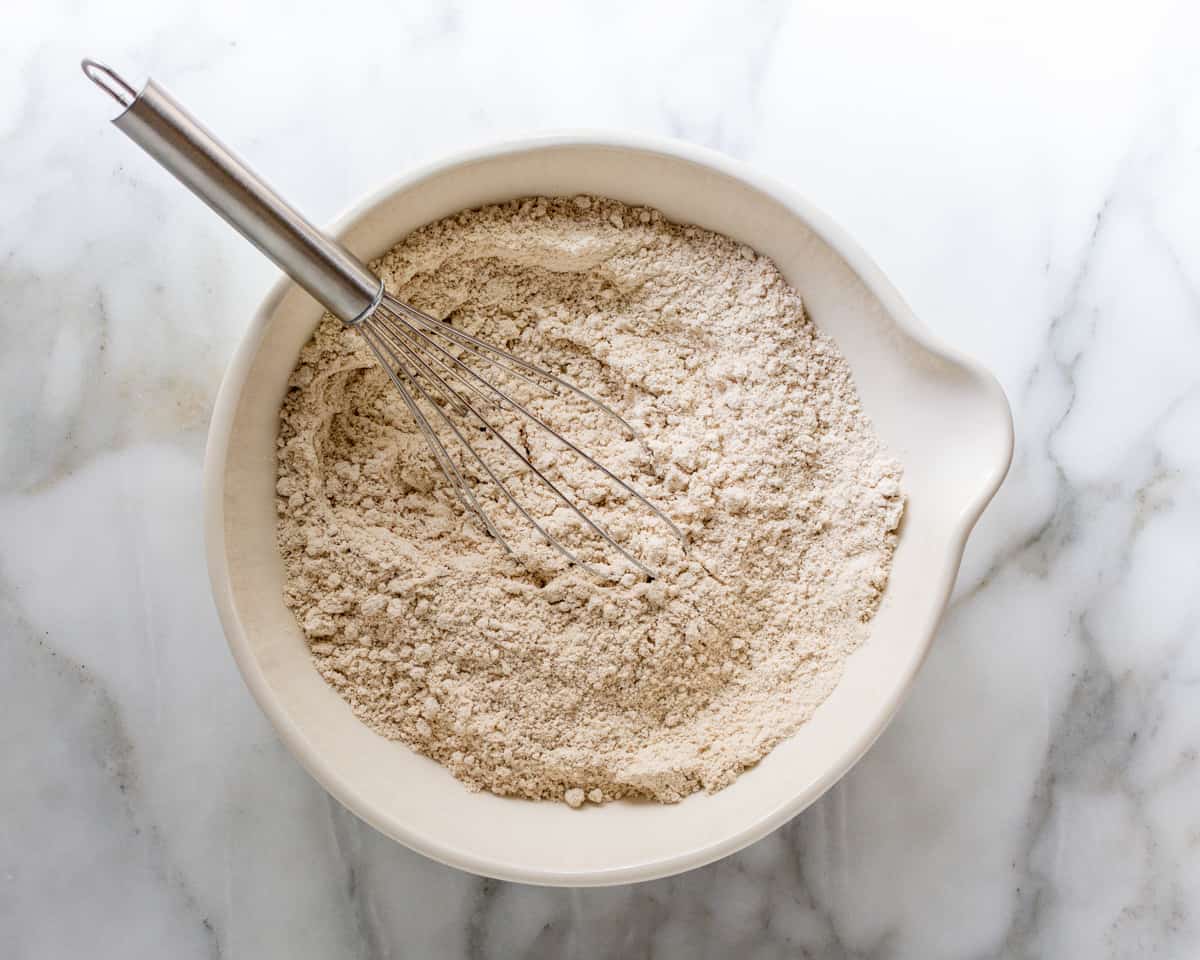 Dry Ingredients in a bowl with a whisk.