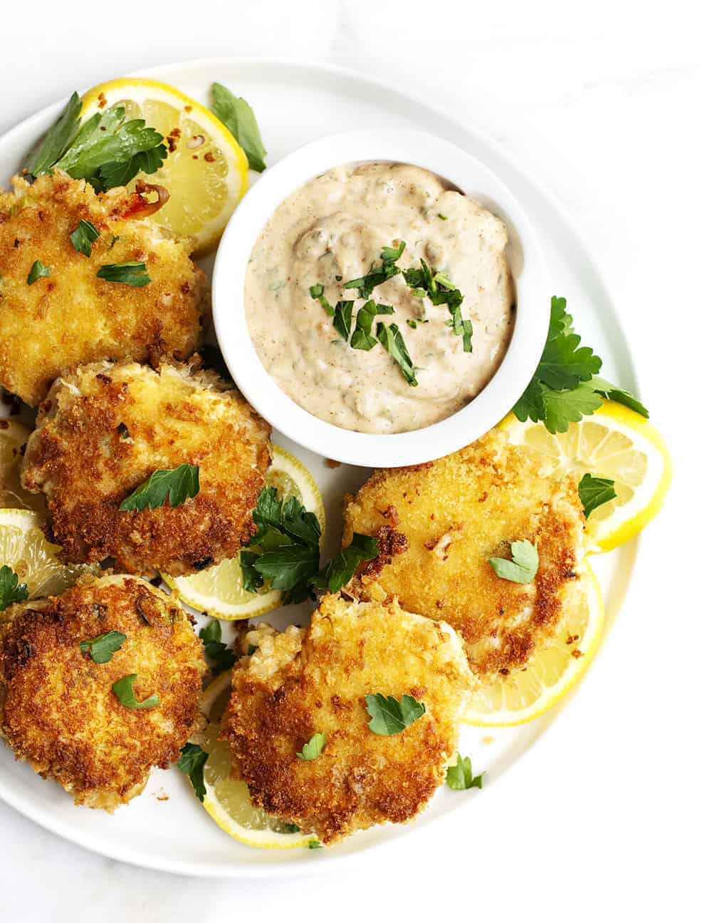 Easy Crab Cakes served with Remoulade Sauce on a White Plate