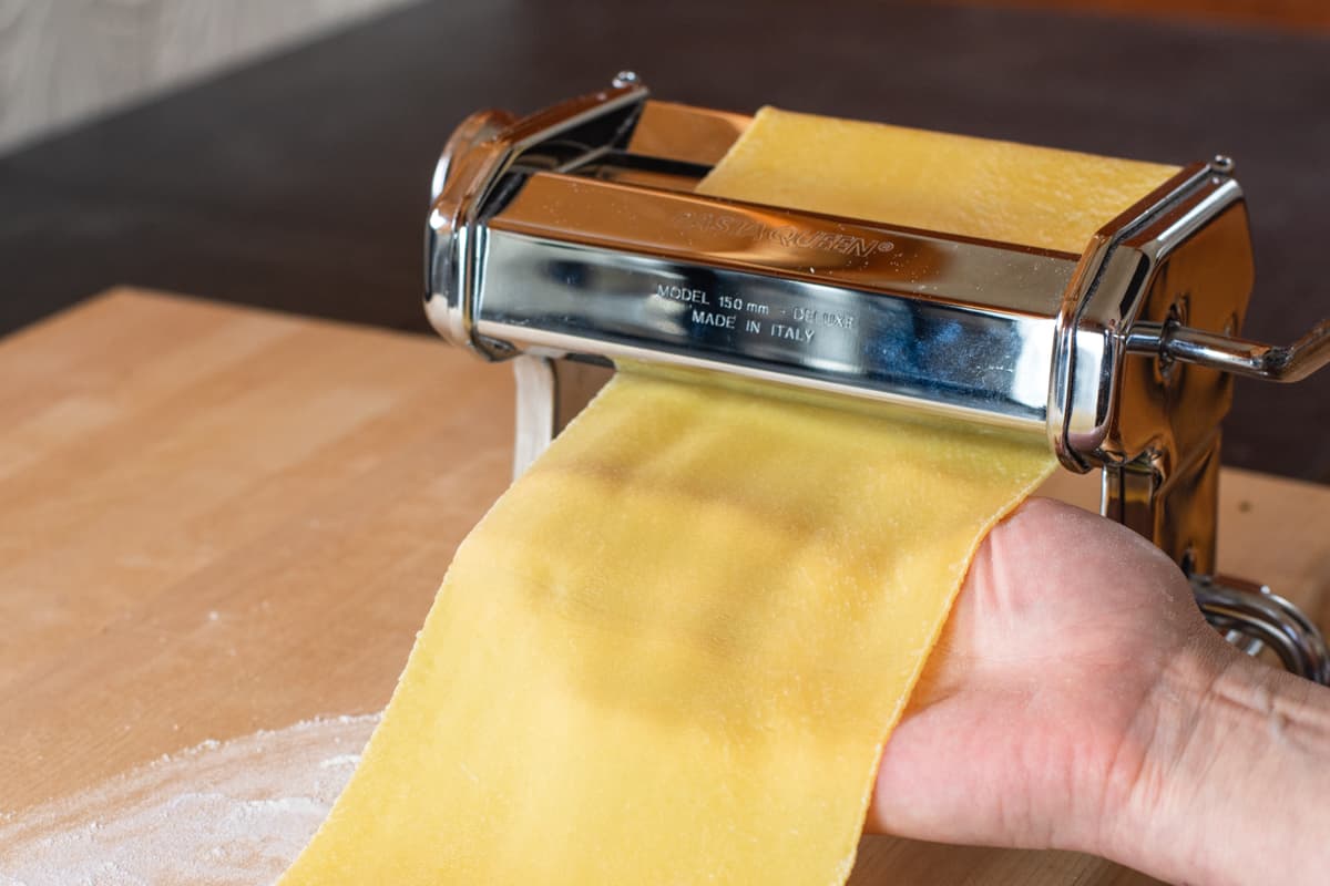 Final Pass of pasta dough through machine rollers