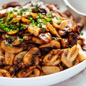 Garlic Butter Mushrooms served in a white bowl.