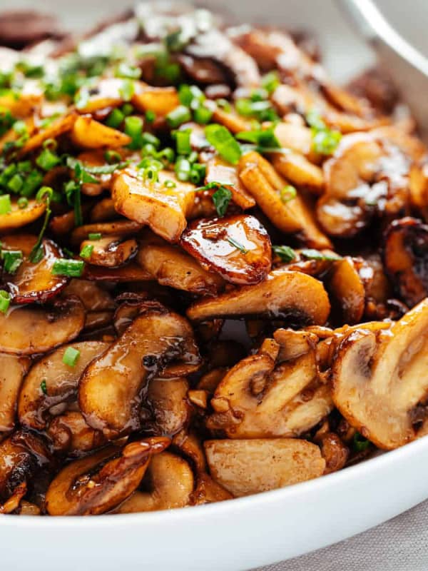 Garlic Butter Mushrooms served in a white bowl.