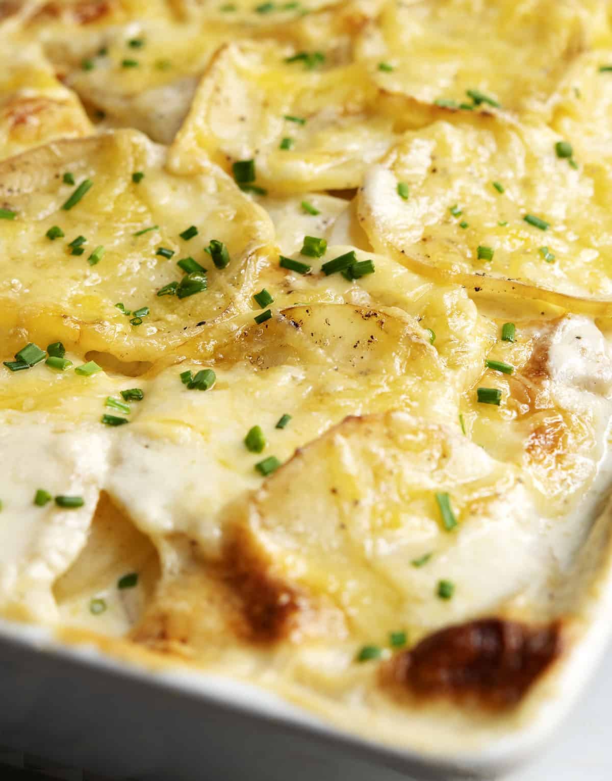 Gratin Dauphinois served in a white casserole dish