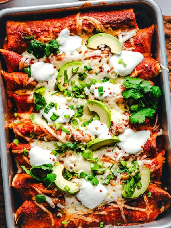 Ground Turkey Enchiladas served in a metal pan.