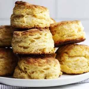 Homemade Biscuits stacked on a white plate