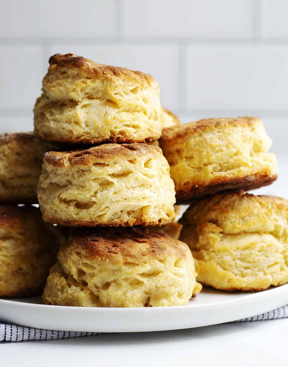 homemade biscuits stacked on a plate