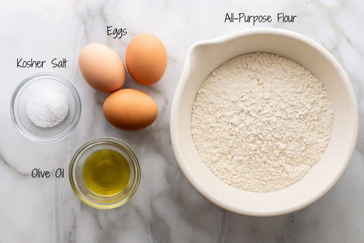 Homemade Lasagna Noodle Ingredients on a white marble board