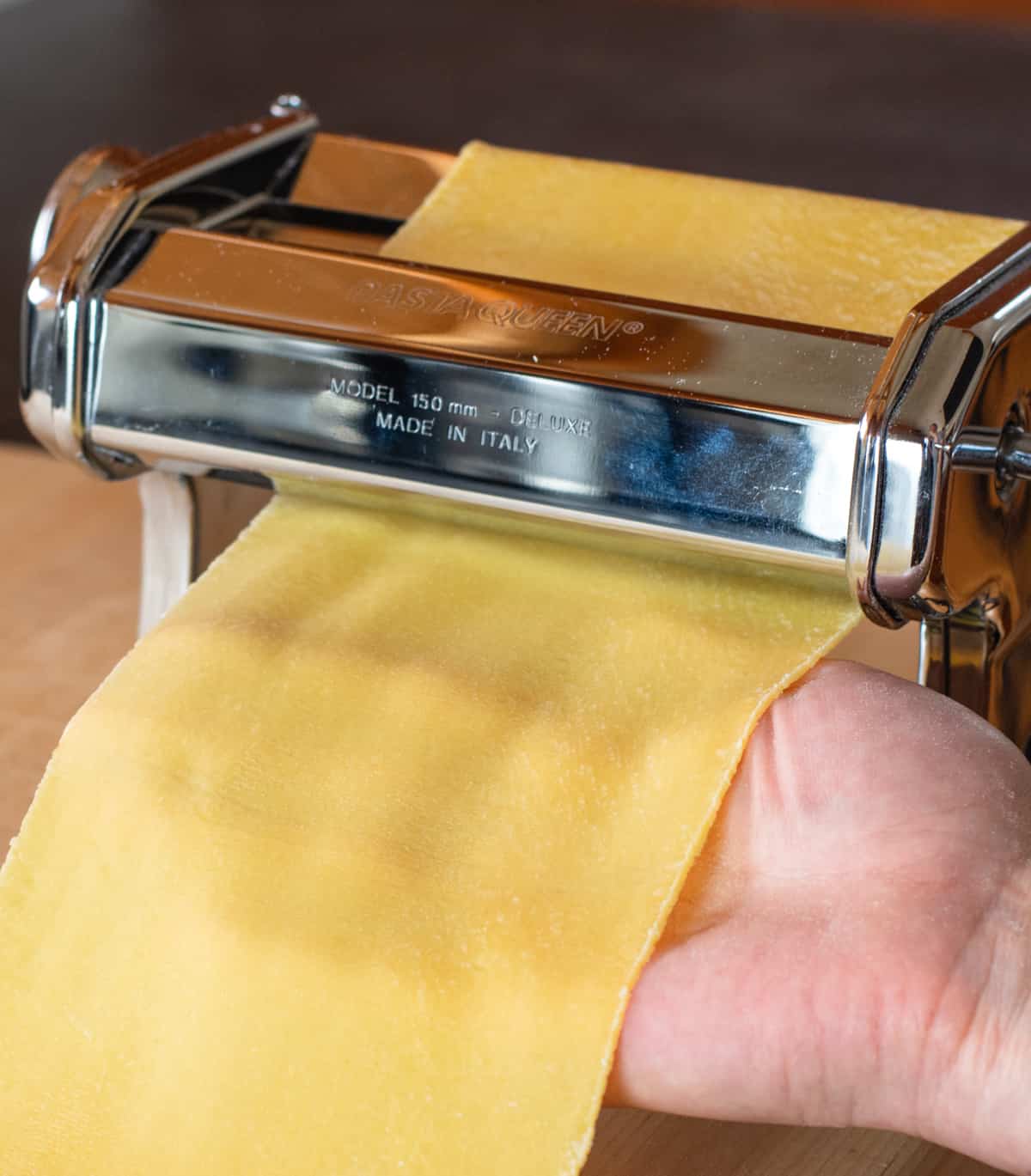 Final Pass of pasta dough through machine rollers