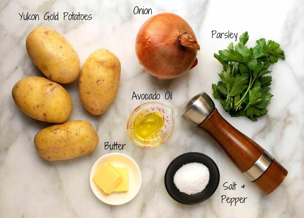 Lyonnaise Potatoes Ingredients on a white marble board