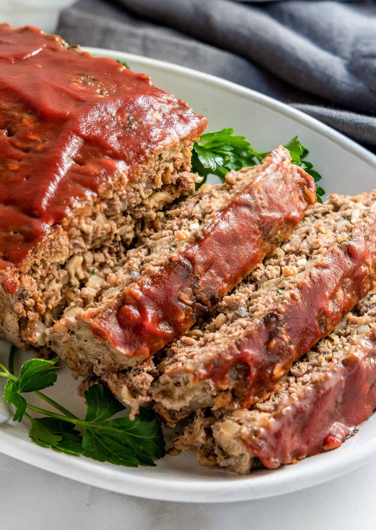 Meatloaf with Oatmeal close up slices on white platter