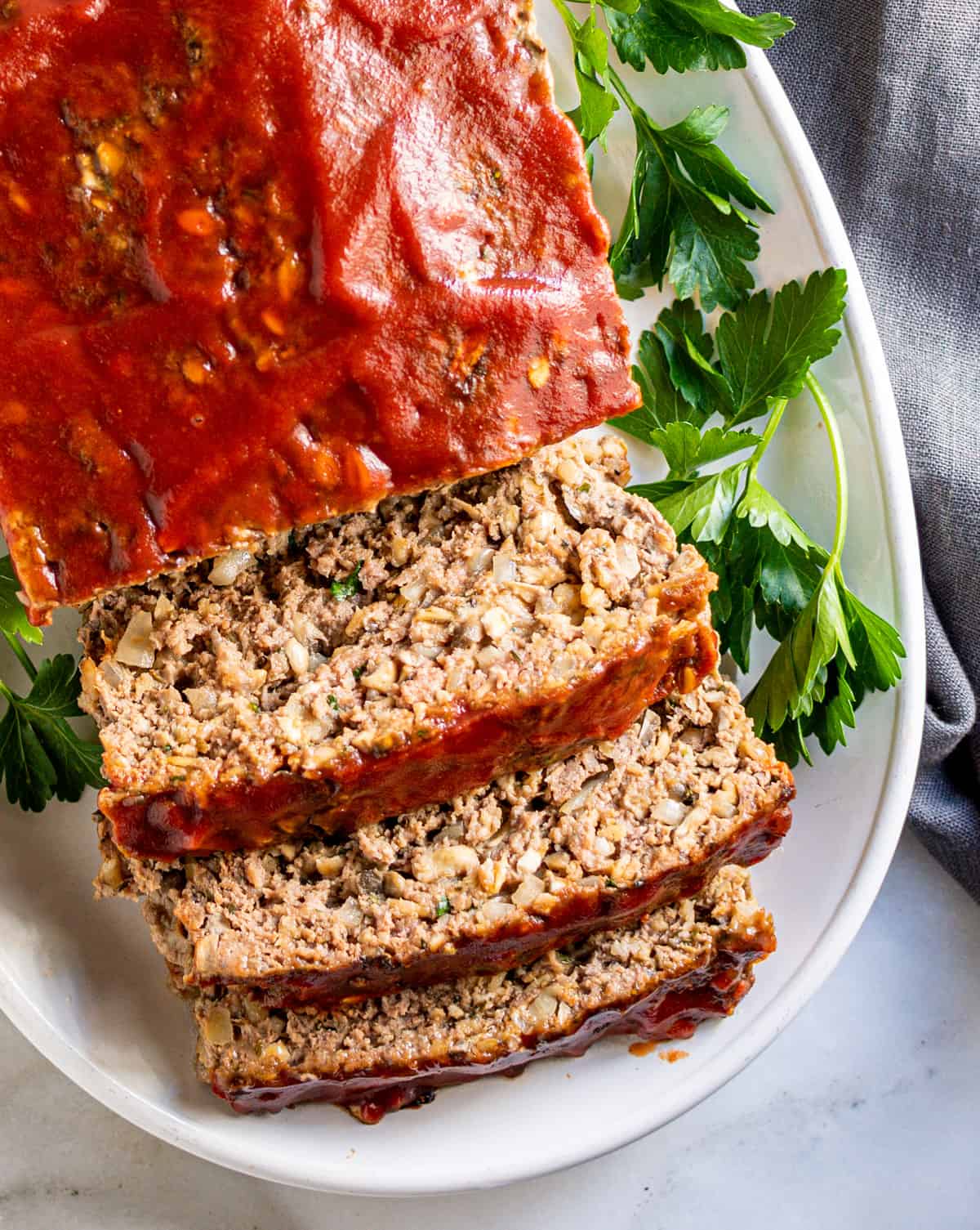 Meatloaf with Oatmeal sliced on an oval white platter.