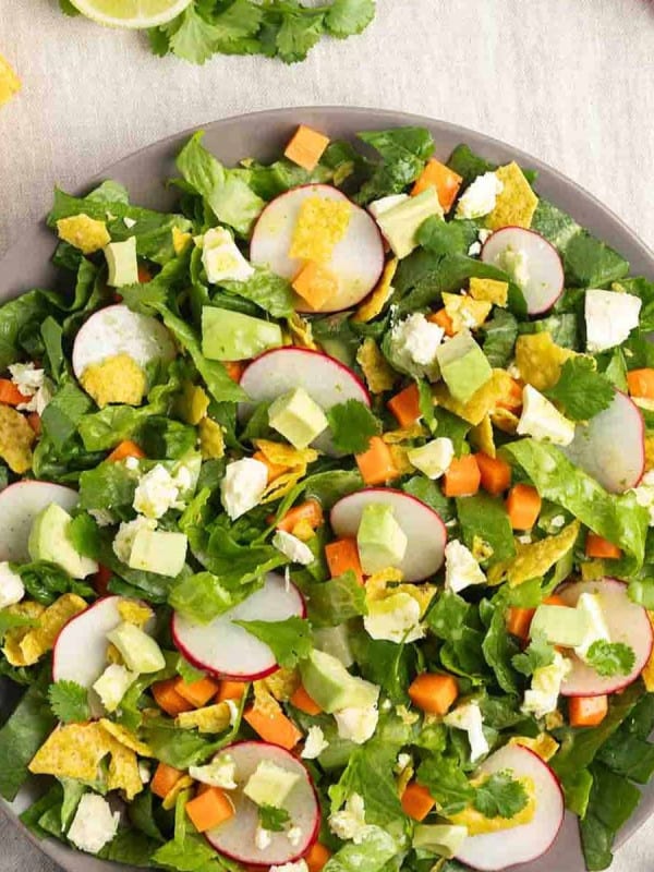 Mexican Chopped Salad served on a gray plate and photographed from the top.