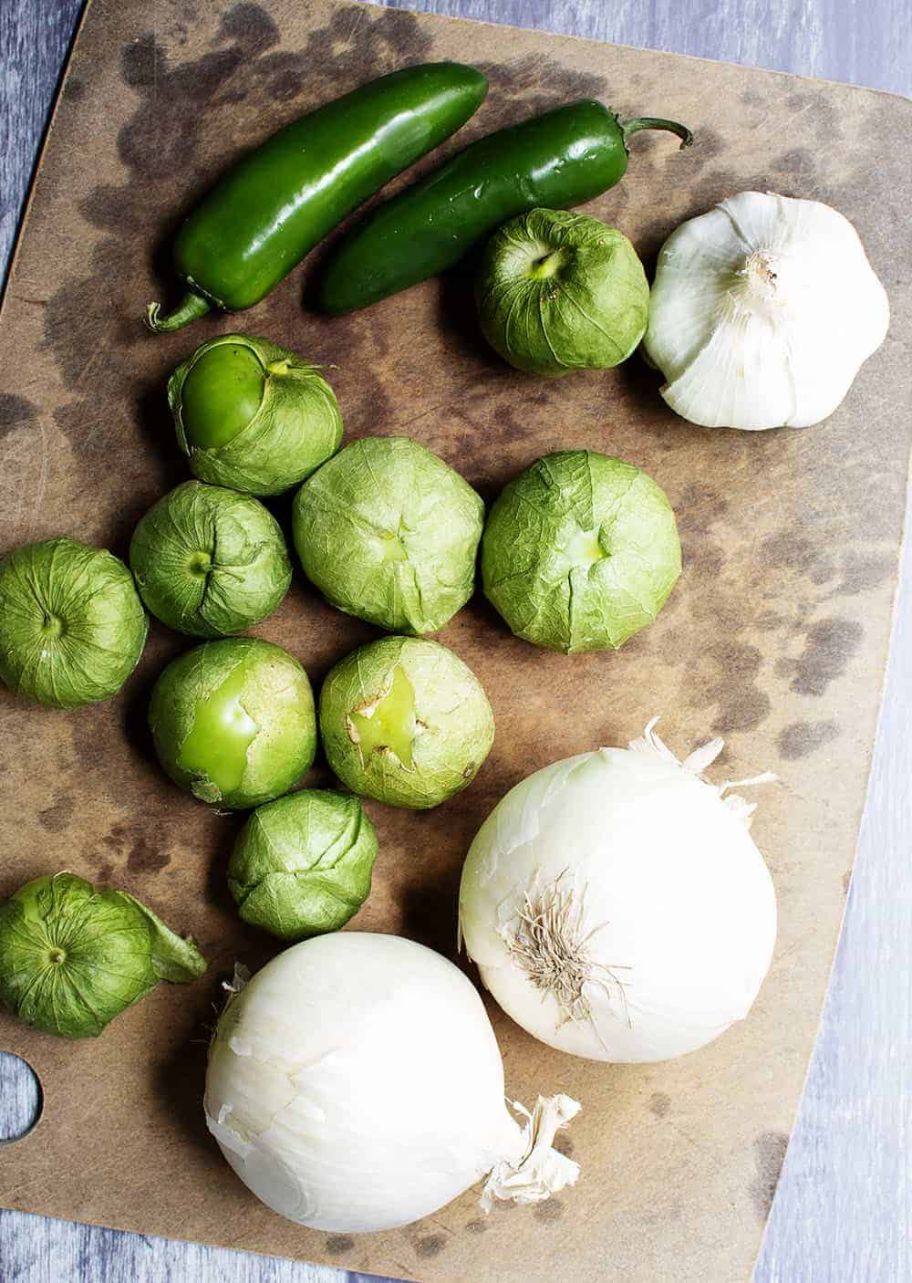 Onions Garlic and Chiles on a cutting board