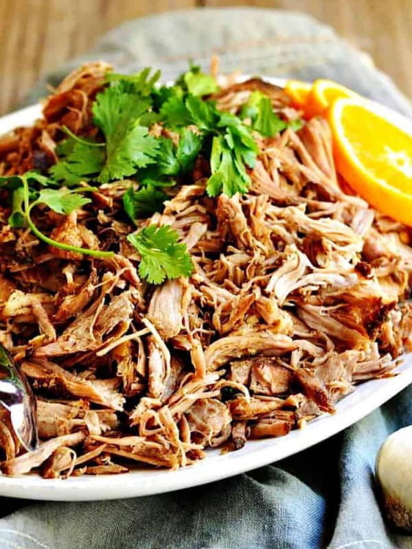 Slow Cooker Pork Carnitas served on a white oval platter