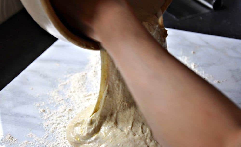 Pouring English Muffin Dough on to the floured pastry board