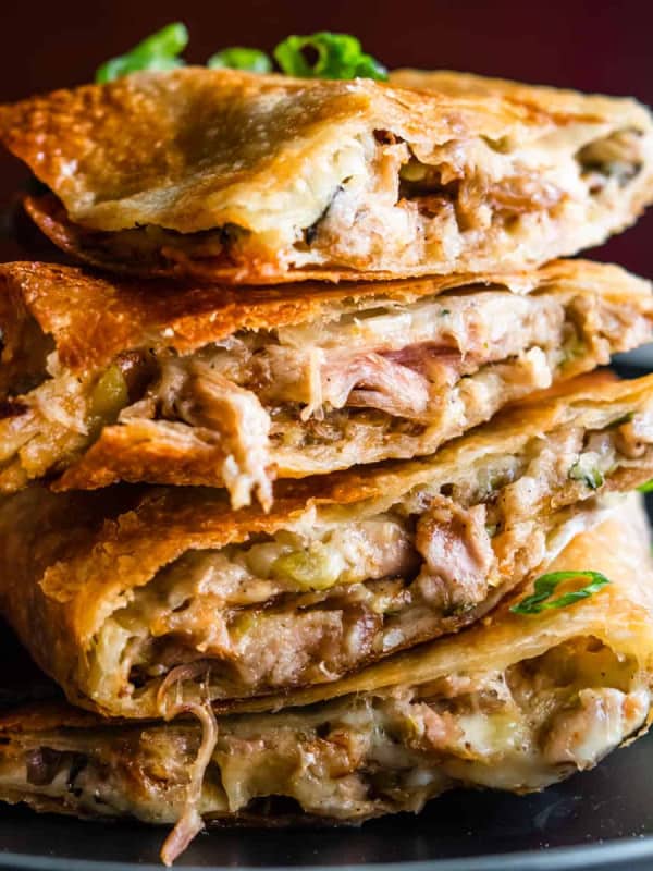 Pulled Pork Quesadillas stacked on a black plate