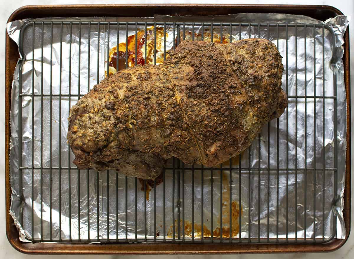 Roasted Boneless Leg of Lamb on rack in rimmed baking sheet