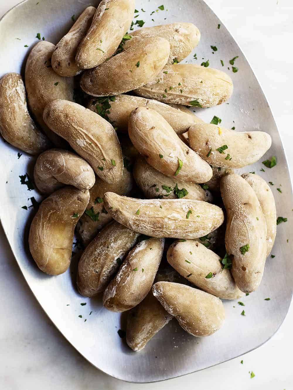 salt potatoes served on a brushed metal platter