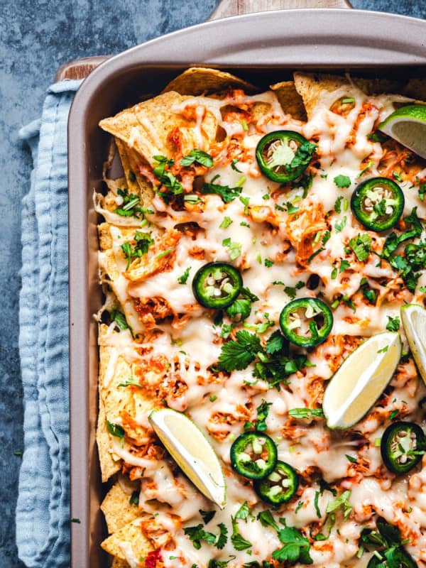 Shredded Chicken Nachos in a rimmed baking sheet photographed from the top.