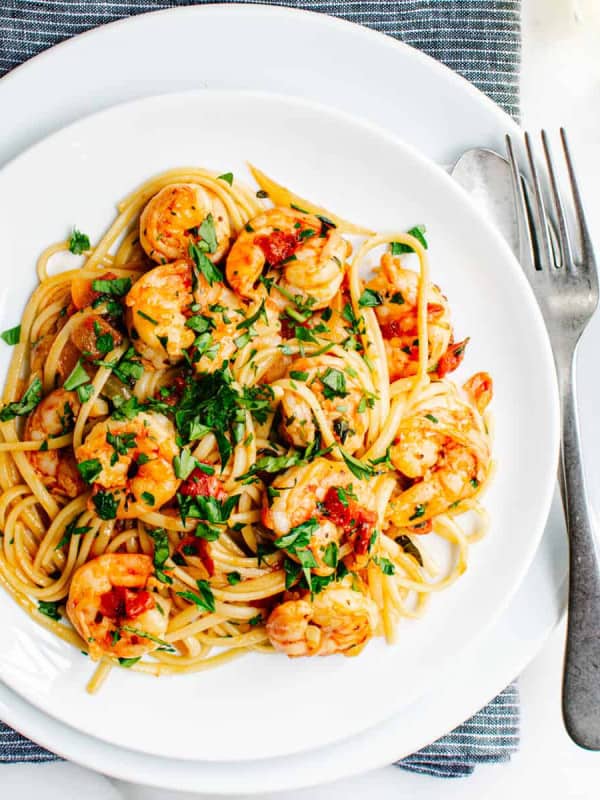 Shrimp Fra Diavolo served on a white shallow bowl and photographed from above.