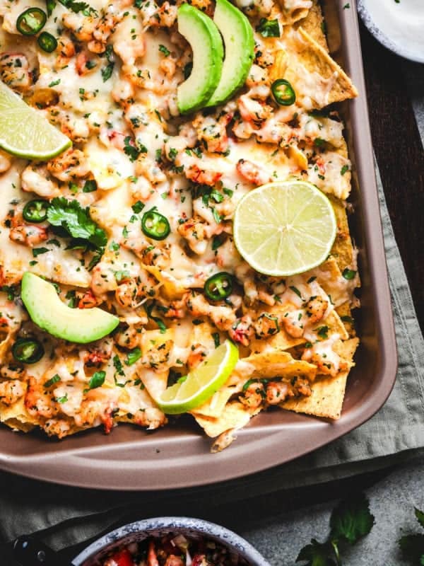 Shrimp Nachos served in a baking pan.