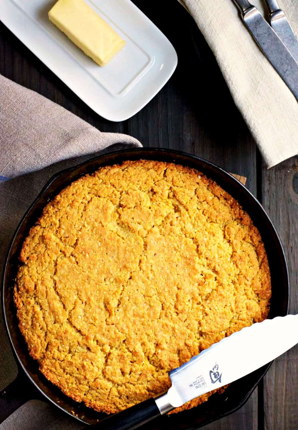 Skillet-Cornbread-with-knife-butter and napkins